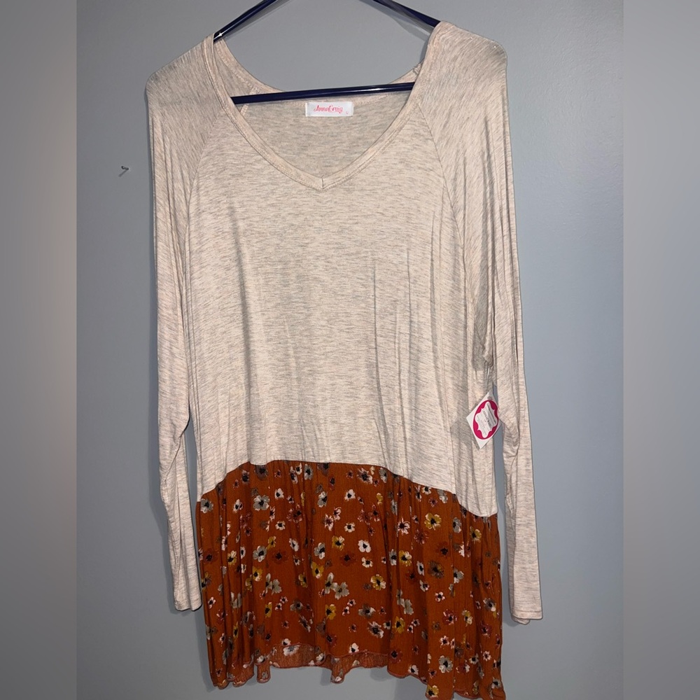 Beige peplum top with floral